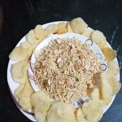 A picture of Mixture made from potato and dry fruits.