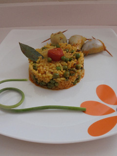 Una foto de Calamares rellenos del mar con timbal de arroz