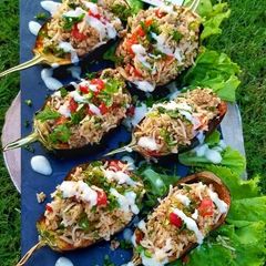 A picture of Stuffed eggplant with tahini sauce.