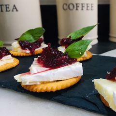 A picture of Brie and Cranberry Sauce Canapés.