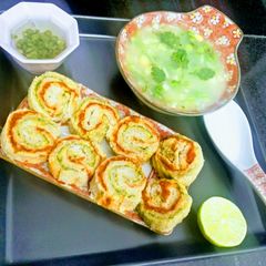 A picture of Pinwheel sandwiches with vegetable soup.