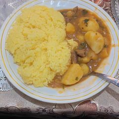 Beef stew and rice A picture of Beef stew and rice.
