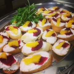 A picture of Goats cheese, mango and beetroot crostini.