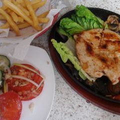 A picture of My Sizzling Chicken on a platter 😆.