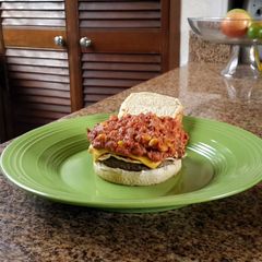 A picture of Beans and doble chesse burger.