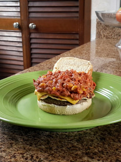 A picture of Beans and doble chesse burger.