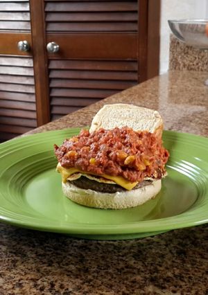 A picture of Beans and doble chesse burger.