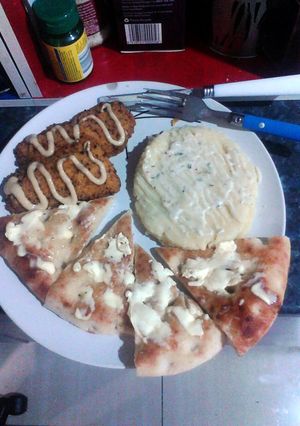 A picture of Delicious Dory Fillets with Creamy Mashed Potato and Garlic and Herb Turkish Bread..