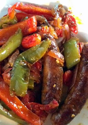 A picture of Sausages and peppers.