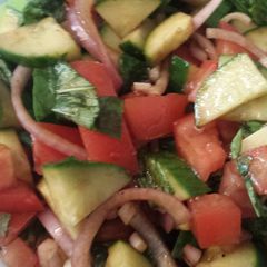 A picture of Tomato basil cucumber salad.