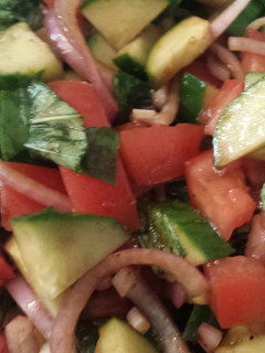 A picture of Tomato basil cucumber salad.