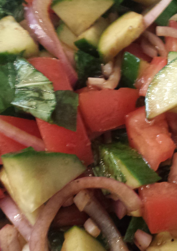 A picture of Tomato basil cucumber salad.