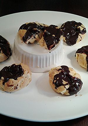 A picture of Salted -Caramel Cream Puffs with Chocolate Ganache Glaze.