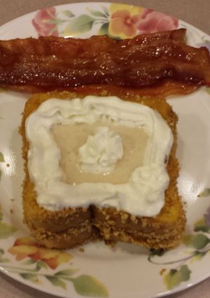 A picture of Crusted french toast with banana puree.