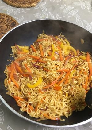 A picture of Stir fried noodles with veg.