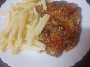 Una foto de bistec de ternera frito