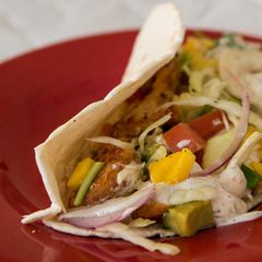 A picture of Fish Tacos & Slaw with White Sauce.