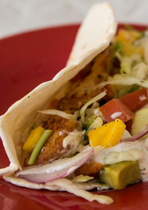 A picture of Fish Tacos & Slaw with White Sauce.