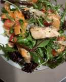 Filling healthy dinner: salmon salad with horsradish dressing and garlic bread on the side