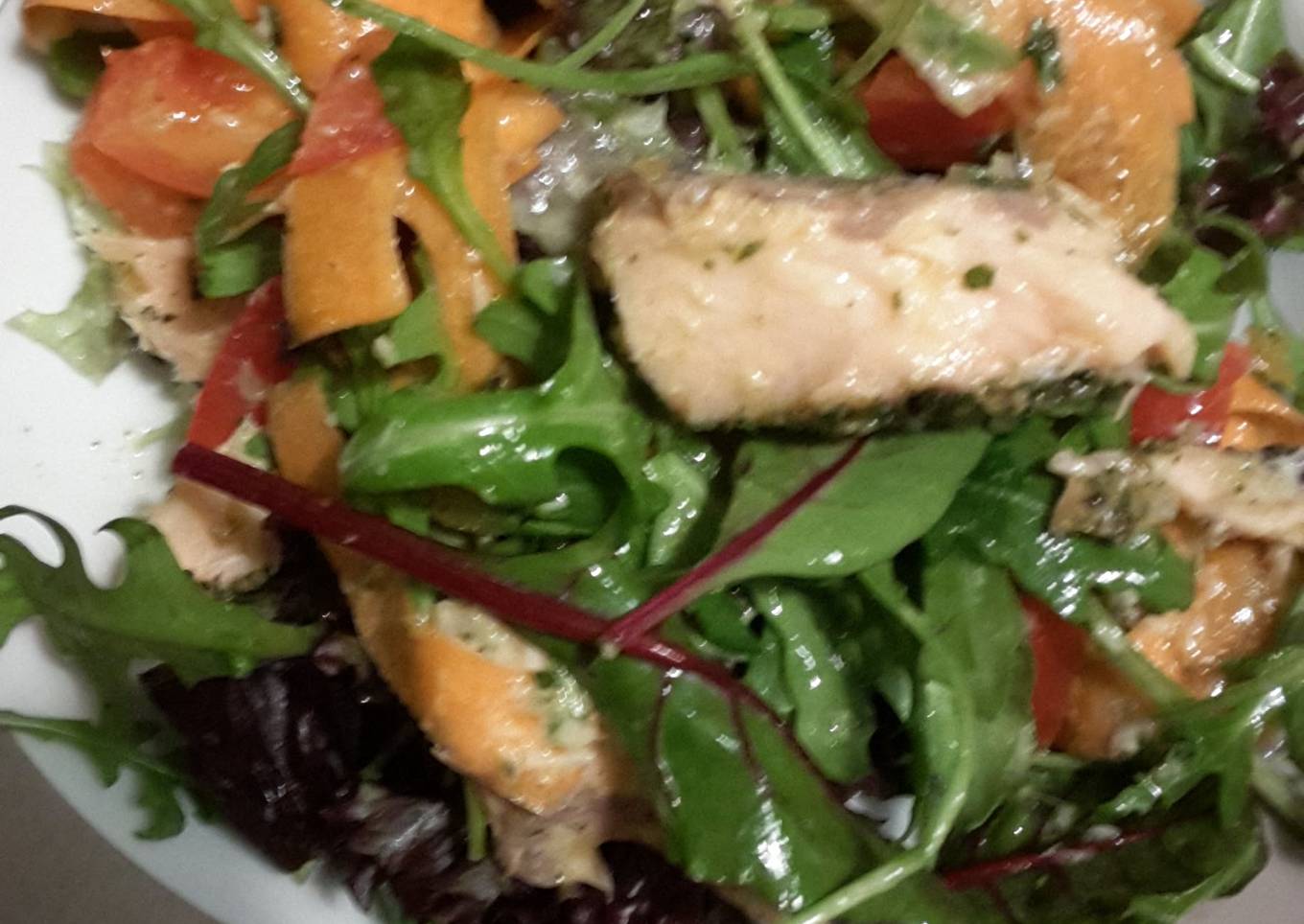 Filling healthy dinner: salmon salad with horsradish dressing and garlic bread on the side