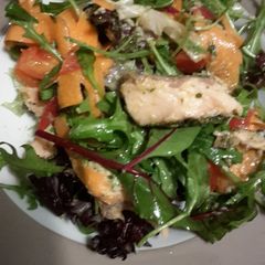 A picture of Filling healthy dinner: salmon salad with horsradish dressing and garlic bread on the side.