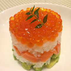 A picture of Salmon Caviar and Avocado Sushi Cake.
