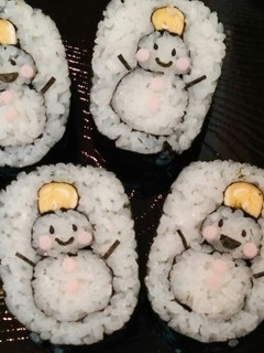 A picture of Decorated Sushi Rolls: Snowmen Nori Rolls.