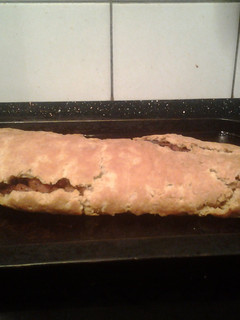 A picture of Baked bacon and onion roly poly.