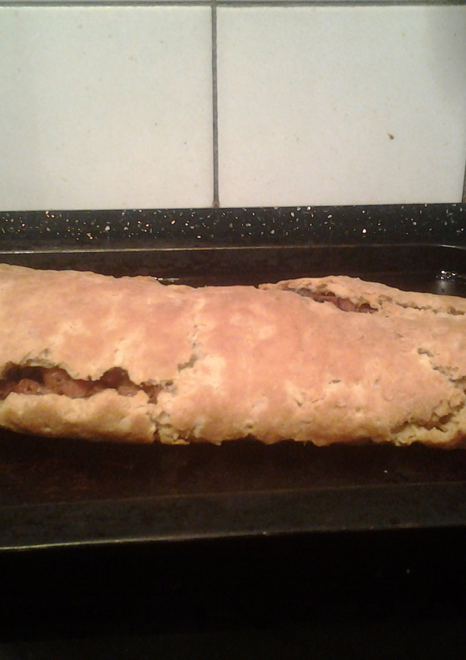 A picture of Baked bacon and onion roly poly.