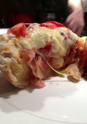 A picture of Bacon and Peperoni Pizza, Chicago Style.