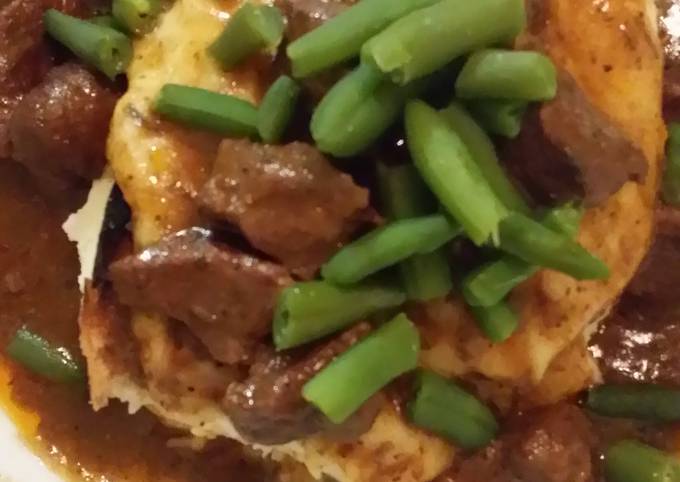 Patty's Slow cooked beef cubes on top of mountain of fluffy mash