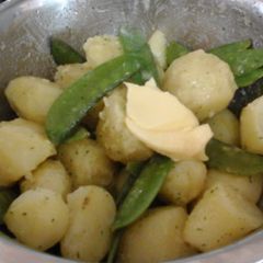 A picture of My New Potatoes in Garlic Parsley Butter with Pea Pods 😙.