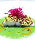 Branzino in crosta di pistacchi e crema di piselli, basilico e menta