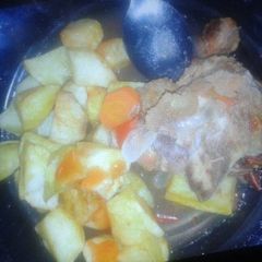 A picture of Fried potatoes and beef.