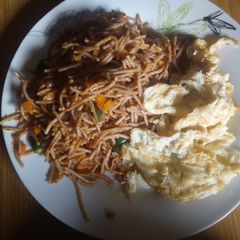 Noodles and Egg, garnished with veggies A picture of Noodles and Egg, garnished with veggies.
