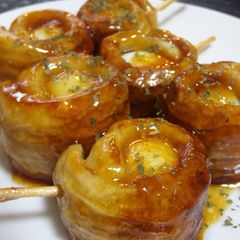 A picture of Teriyaki Chikuwa Rolls with Quail Eggs.