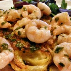 A picture of Sig's Onion Cakes with Prawns in Wild Garlic Butter.