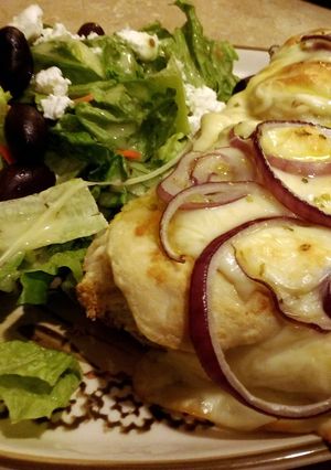 A picture of French bread chicken alfredo pizzas.