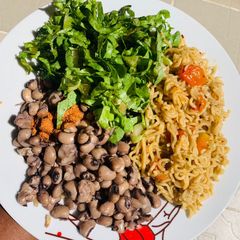 A picture of Noodles with beans.