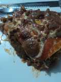 Pastel de tortilla de frijoles con chiles dorado, epazote y queso las Correa