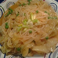 A picture of Rice sticks, cabbage, and peas.