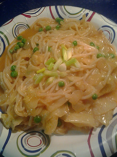 A picture of Rice sticks, cabbage, and peas.