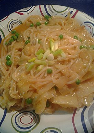 A picture of Rice sticks, cabbage, and peas.