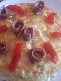Una foto de Tortilla de patatas rellenas
