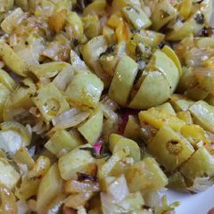 A picture of Veggies stuffed apple gourd.