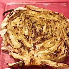 A picture of Roasted cabbage steaks w/rubbed garlic.