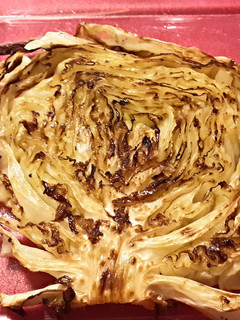 A picture of Roasted cabbage steaks w/rubbed garlic.