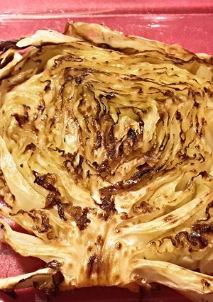 A picture of Roasted cabbage steaks w/rubbed garlic.