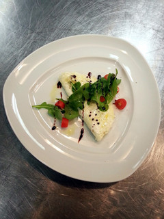 A picture of White omlet with rocket salad.