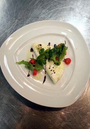 A picture of White omlet with rocket salad.